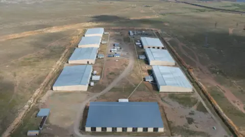 Enegix Ekibastuz crypto mine. 8 large industrial warehouses in the desert.