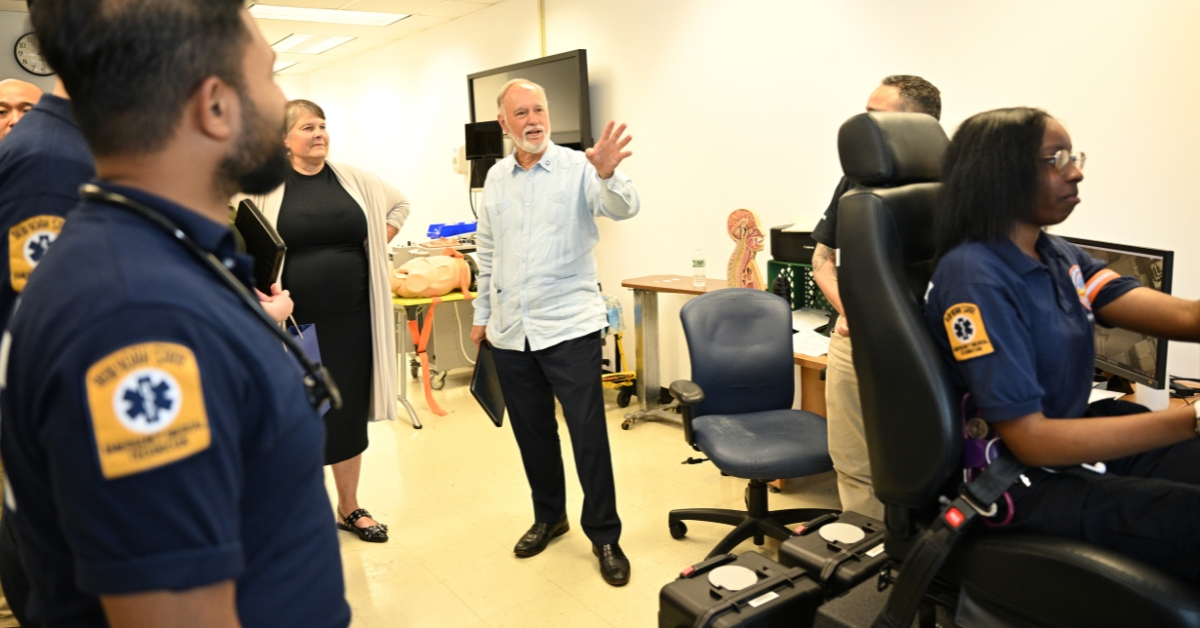 CUNY Chancellor watches a EMT program student