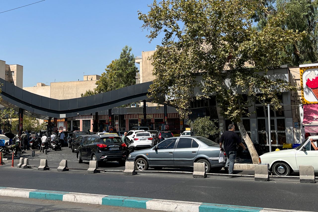 Drivers line up at a petrol station in Tehran on Tuesday.