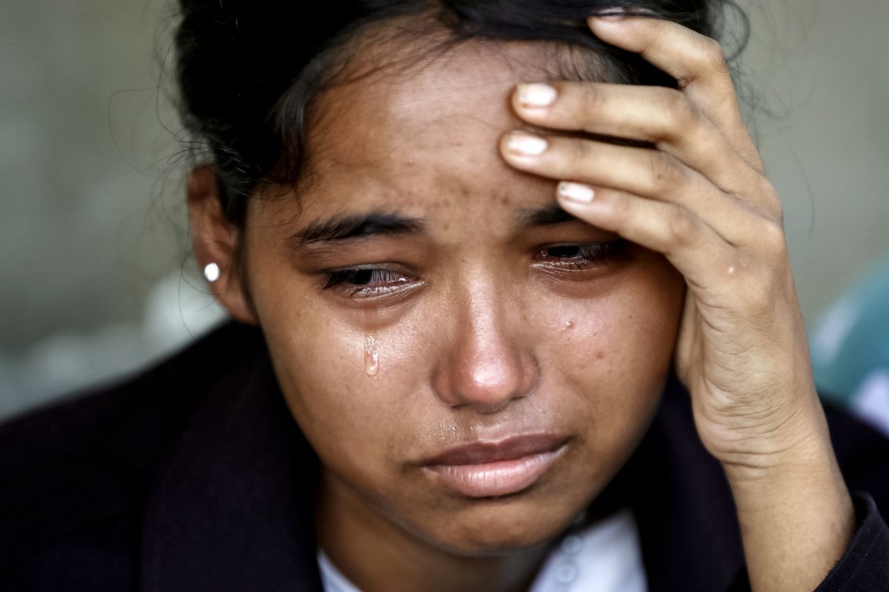 A woman cries after being rescued at an army camp, in Battar Bazar town in Nepal's Nuwakot district on Friday.