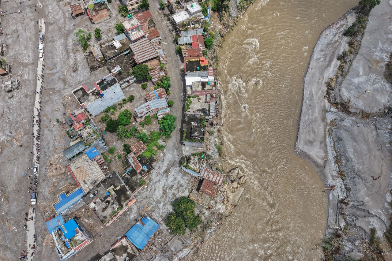 An aerial photo shows houses at a town along the Trishuli River destroyed by the flash floods in Devighat, Nepal, on August 29.
