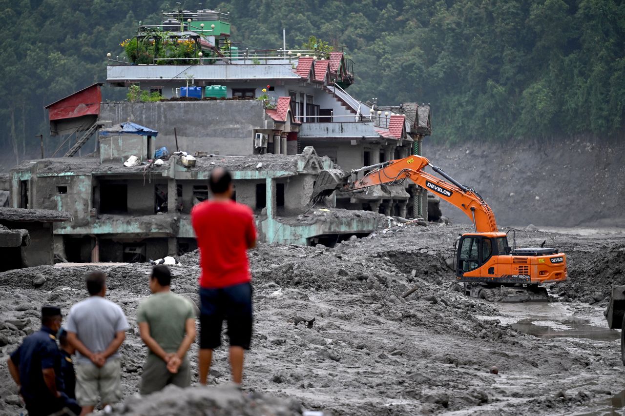 Rescue work continues in the aftermath of flash floods at Trishuli Center in Nepal's Nuwakot district on Monday.