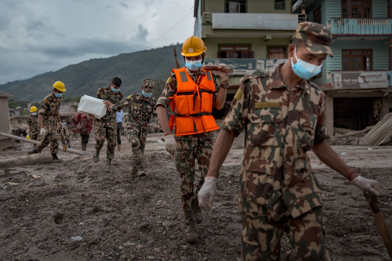 Soldiers search for bodies as rescue operations shift into search and retrieval, following flash floods on August 29, 2026 in Devighat, Nepal.