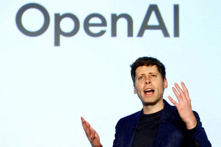 Altman speaking at an event in front of OpenAI logo