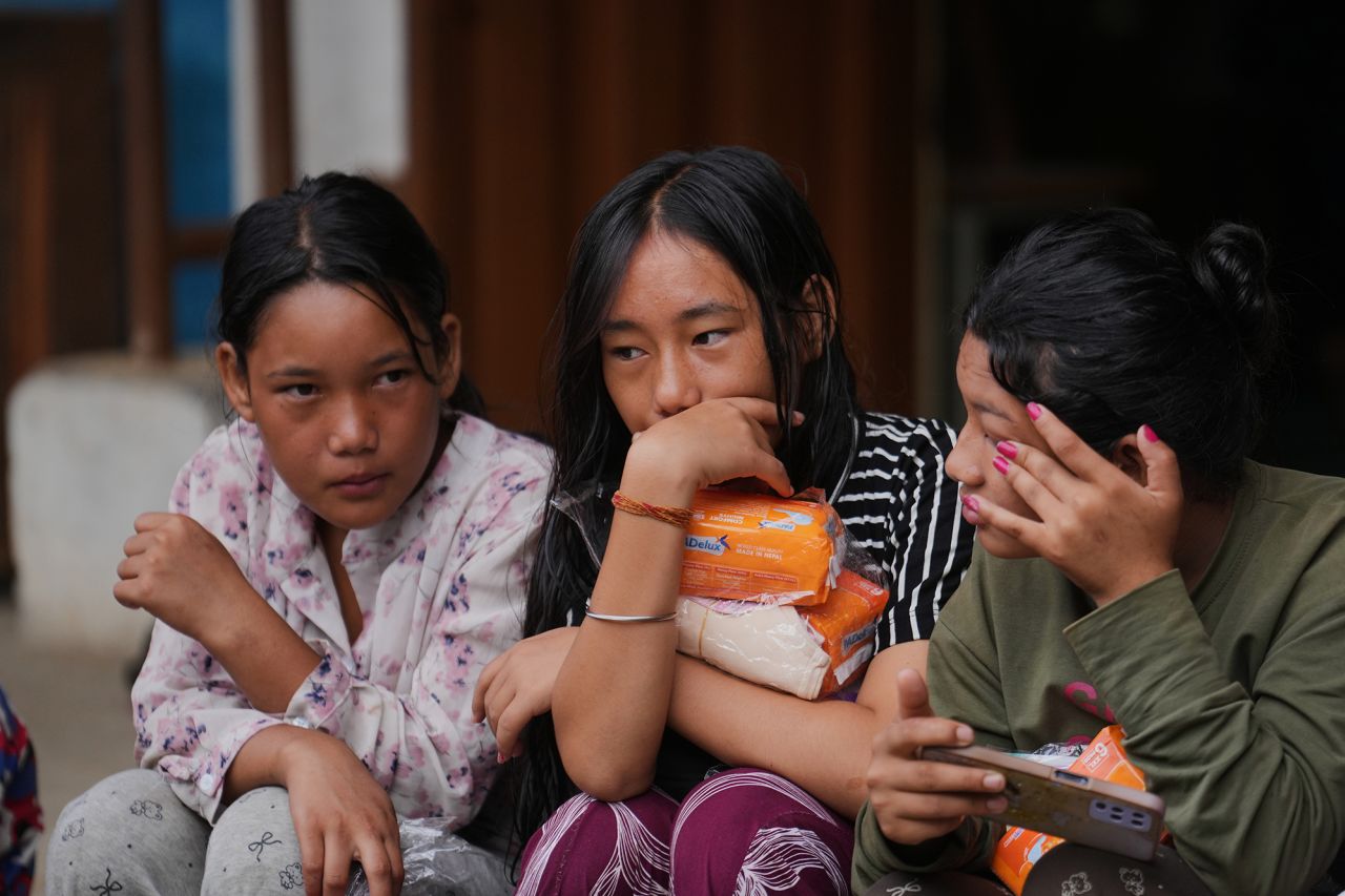 Displaced girls sit at a school converted into a temporary shelter for displaced residents in residents in Bidur, in Nepal's Nuwakot district, on Tuesday.