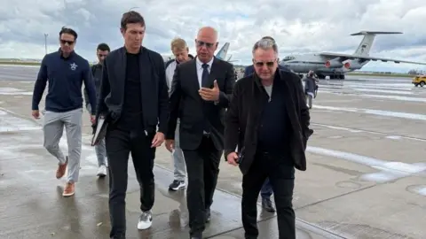 Reuters Jared Kushner (left) and Steve Witkoff (right) pictured with Russia's Kirill Dmitriev (centre) on arrival in Moscow