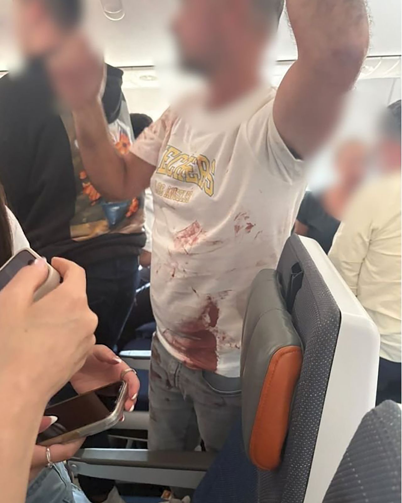 A photo shows a passenger on board the Flydubai flight. Portions of this image have been blurred by CNN for privacy.