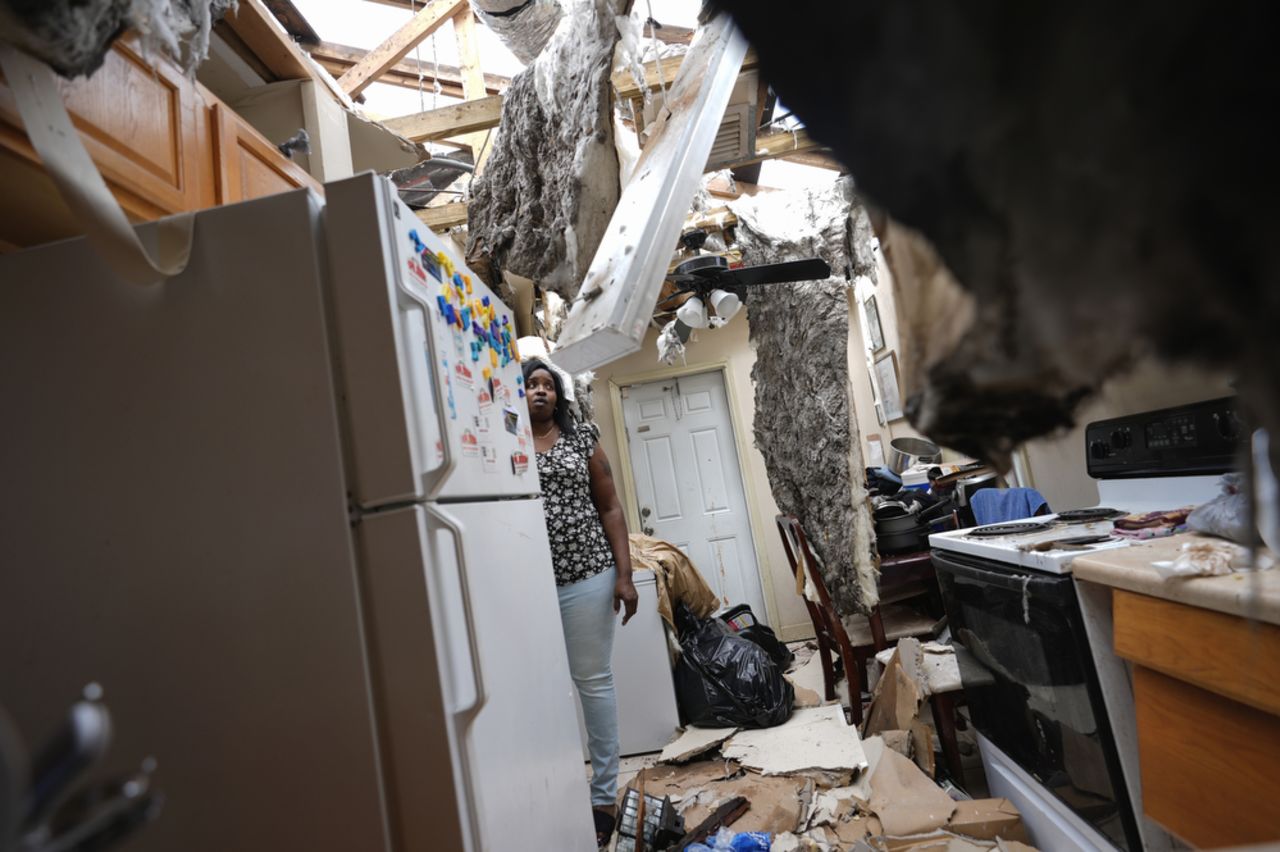Natasha Ducre stands in the kitchen of her damaged home following Hurricane Milton in Palmetto, Florida, in October 2024.