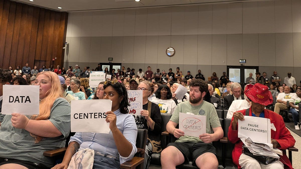 Residents gather inside Memphis City Council chambers voicing support for a data center moratorium.