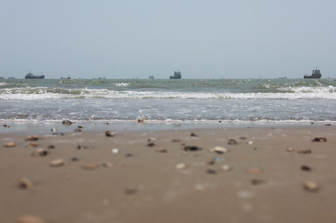 Vessels in the Strait of Hormuz are visible near the beach of Bandar Abbas, Iran, on Tuesday.