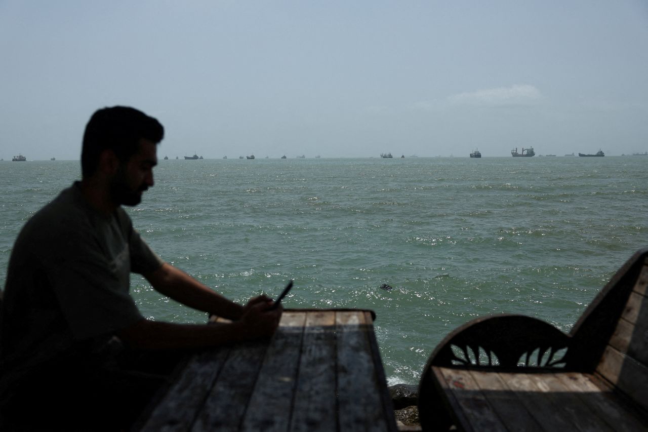 Vessels in the Strait of Hormuz are visible near the beach of Bandar Abbas, Iran, August 26.